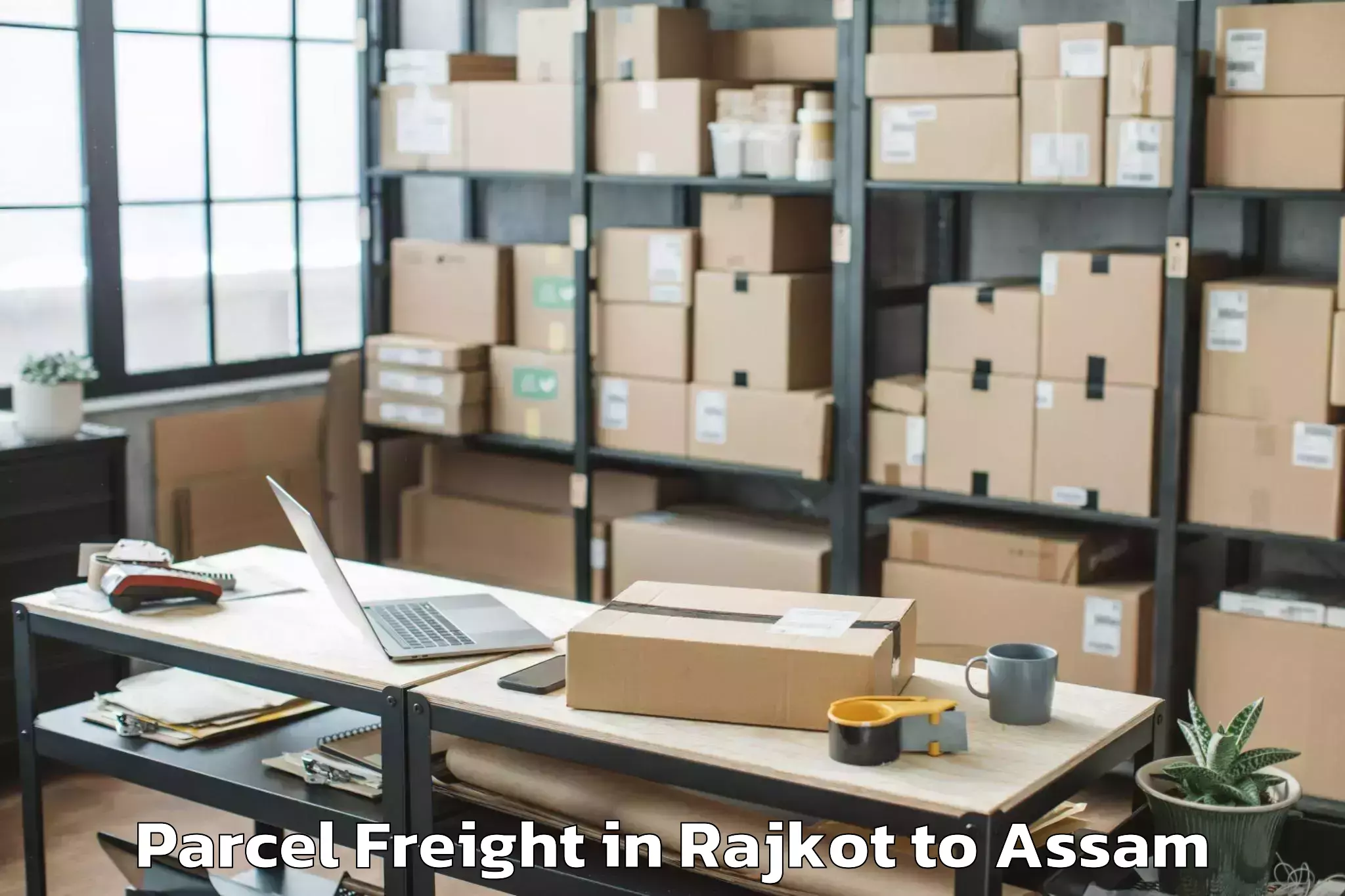 Book Rajkot to Salonibari Airport Tez Parcel Freight